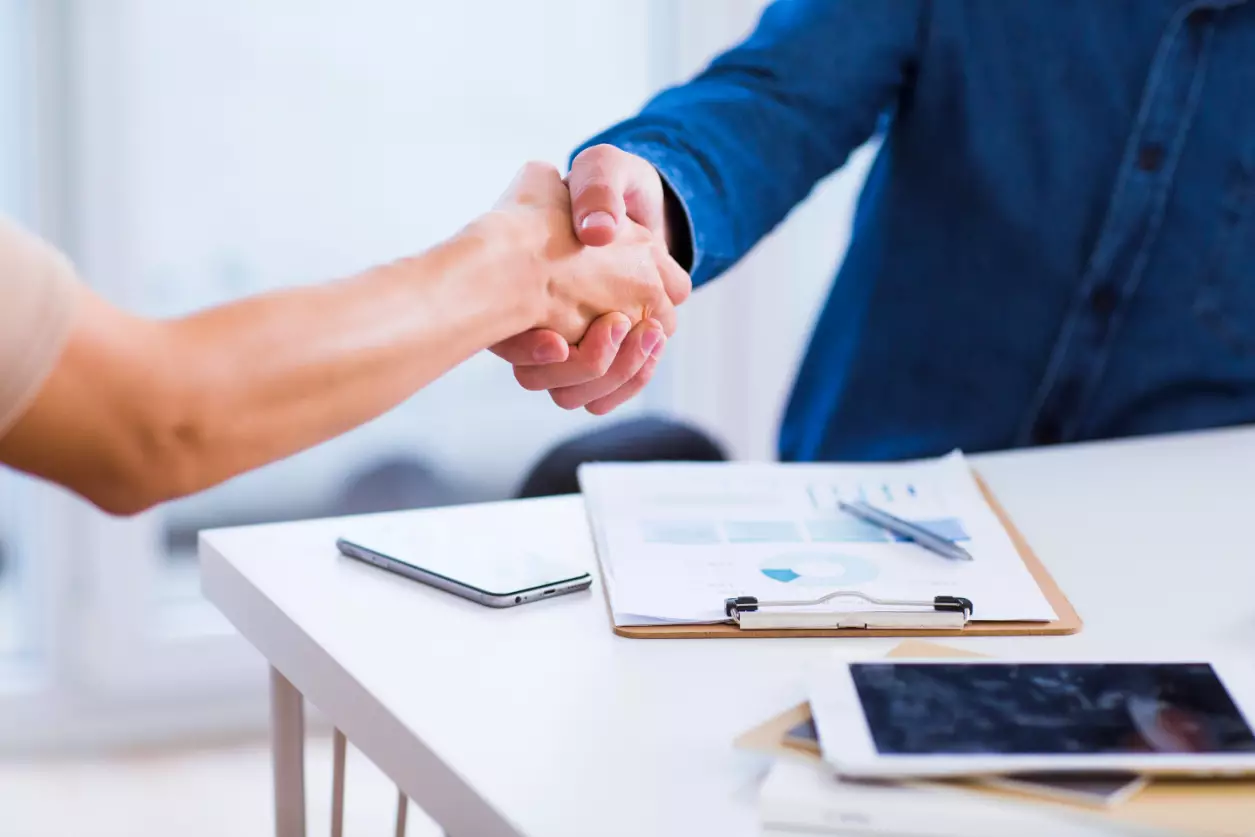 Businessman And Businesswoman Shaking Hands Businessman And Businesswoman Shaking Hands