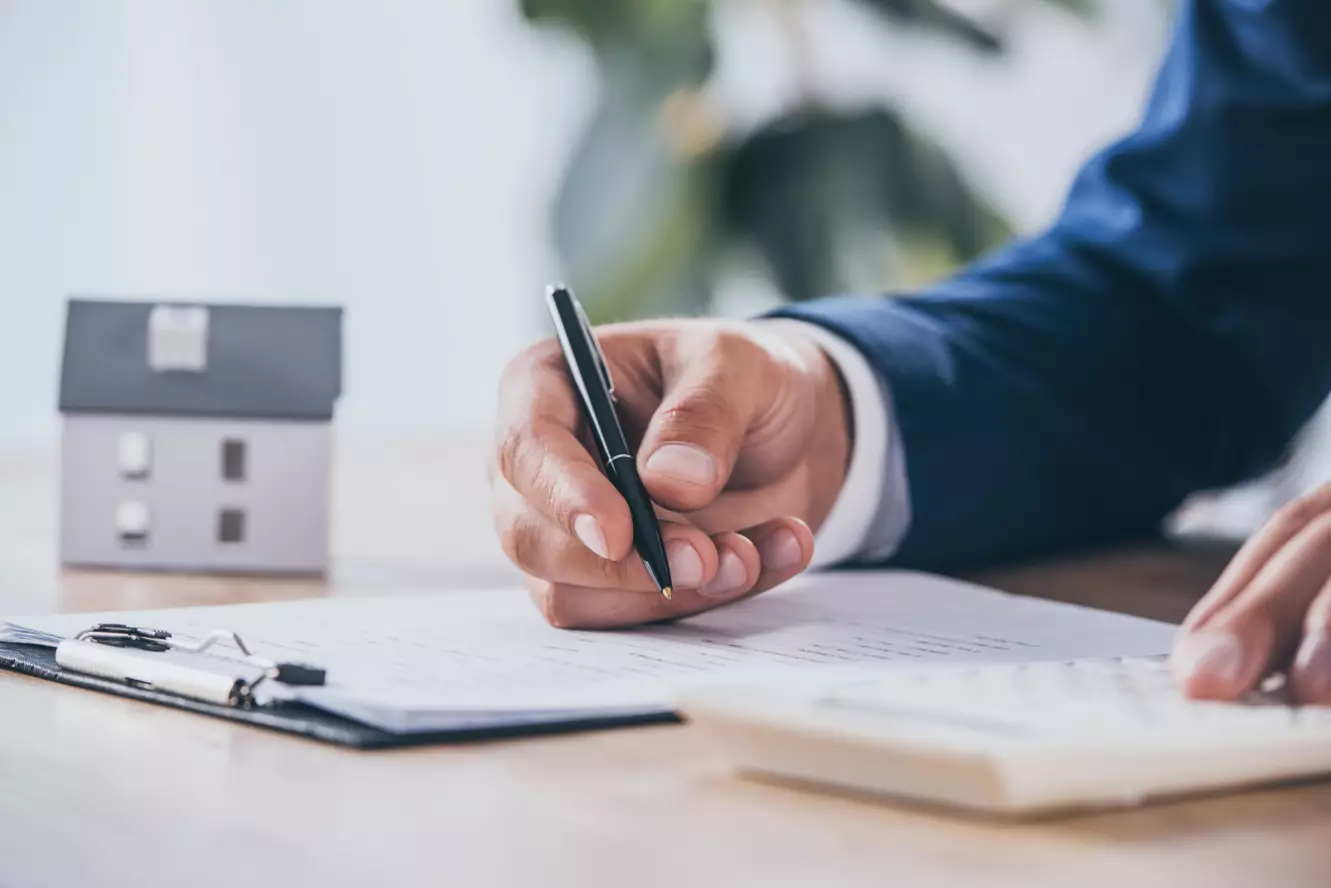View Businessman Using Calculator View Businessman Using Calculator